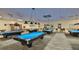 Well-lit billiards room with several pool tables at 302 Canton Ct # 56, Sun City Center, FL 33573