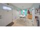 Cozy dining area with white table and chairs near the entryway at 302 Canton Ct # 56, Sun City Center, FL 33573