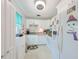 Clean and efficient kitchen with white cabinets and modern appliances at 302 Canton Ct # 56, Sun City Center, FL 33573