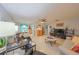 Open concept living and dining area with tile floors and ceiling fan at 302 Canton Ct # 56, Sun City Center, FL 33573