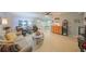 Living room features comfortable seating and views into dining area at 302 Canton Ct # 56, Sun City Center, FL 33573
