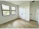 Spacious bedroom with large windows and light wood floors at 4204 N 13Th St, Tampa, FL 33603
