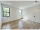 Bright bedroom with two windows and wood flooring at 4204 N 13Th St, Tampa, FL 33603