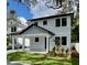 Two-story home with modern facade, landscaping, and driveway at 4204 N 13Th St, Tampa, FL 33603