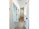 Bright hallway with light wood floors and white doors at 4204 N 13Th St, Tampa, FL 33603