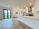 Modern kitchen with white cabinets, quartz countertops and island at 4204 N 13Th St, Tampa, FL 33603