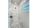 Contemporary shower with marble-look walls and patterned floor at 4204 N 13Th St, Tampa, FL 33603