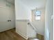 Modern staircase with light-colored wood and white walls at 4204 N 13Th St, Tampa, FL 33603