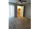 Spacious bedroom with carpet, closet, and sliding door access at 455 Alt 19 S # 75, Palm Harbor, FL 34683