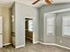 Bright bedroom with wood-look flooring and access to small room at 4732 W Lawn Ave, Tampa, FL 33611