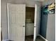 Laundry closet with washer, dryer, and shelving at 4732 W Lawn Ave, Tampa, FL 33611