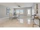 Bright dining room with glass table and modern chairs at 5467 Bayou Grande Ne Blvd, St Petersburg, FL 33703