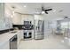 Modern kitchen with stainless steel appliances and white cabinets at 5467 Bayou Grande Ne Blvd, St Petersburg, FL 33703