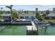 Aerial view of house, pool, and dock at 602 Flamingo Dr, Madeira Beach, FL 33708