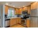 Modern kitchen with stainless steel appliances at 620 Edgewater Dr # 304, Dunedin, FL 34698