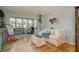 Living area with white couch and access to a patio at 620 Edgewater Dr # 304, Dunedin, FL 34698