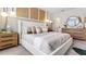 Bright main bedroom with king-size bed and en-suite bathroom at 6314 Sophie Oaks Ct, Tampa, FL 33610