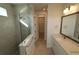 Bright bathroom with a glass-enclosed shower, quartz countertops and access to a walk-in closet at 633 Allora Ave, Nokomis, FL 34275
