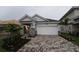 Charming single-Gathering home featuring a two-car garage, neutral paint, and attractive stone column accents at 633 Allora Ave, Nokomis, FL 34275