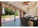 Back porch with seating and view of yard at 690 47Th N St, St Petersburg, FL 33713