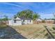 Large backyard with grassy area and wooden fence at 7101 14Th N St, St Petersburg, FL 33702