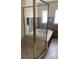 Relaxing bathroom with a jetted tub and a glass-enclosed shower at 909 Mandalay Ave, Clearwater Beach, FL 33767