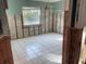 A bedroom under renovation, with new flooring and exposed walls at 909 Mandalay Ave, Clearwater Beach, FL 33767
