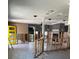Open layout featuring a fireplace, tile floors and bare walls at 909 Mandalay Ave, Clearwater Beach, FL 33767