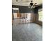 Renovation in progress featuring bare walls, tile floors, and a ceiling fan at 909 Mandalay Ave, Clearwater Beach, FL 33767
