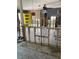 Open living space featuring bare interior walls, tile floors and a view of a bright yellow door at 909 Mandalay Ave, Clearwater Beach, FL 33767