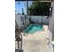 A private backyard oasis featuring a cozy in-ground pool and a charming patio area, perfect for relaxation at 909 Mandalay Ave, Clearwater Beach, FL 33767