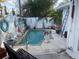 Small, kidney-shaped pool in a backyard setting at 909 Mandalay Ave, Clearwater Beach, FL 33767
