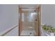 A traditional-style bathroom with a glass enclosed shower, wainscoting, and classic fixtures at 105 Phillips Dr, Seffner, FL 33584