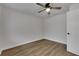 Simple bedroom with wood-look floors and ceiling fan at 105 Phillips Dr, Seffner, FL 33584