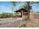 Wooden gazebo with stone path in backyard at 105 Phillips Dr, Seffner, FL 33584