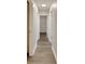 Clean and bright hallway with light grey laminate flooring at 105 Phillips Dr, Seffner, FL 33584