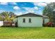 View of house back, highlighting the deck at 1106 E Chelsea St, Tampa, FL 33603