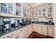 Gourmet coffee bar area with a variety of appliances, ample counter space, and storage in a bright setting at 118 Harbor View Ln, Belleair Bluffs, FL 33770