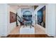 Grand foyer with staircase and unique bull sculpture, showcasing the home's artistic flair at 118 Harbor View Ln, Belleair Bluffs, FL 33770