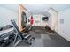 Home gym with fitness equipment, rubber floors and French doors at 118 Harbor View Ln, Belleair Bluffs, FL 33770