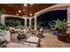 Covered outdoor patio with comfortable seating and access to the pool at 118 Harbor View Ln, Belleair Bluffs, FL 33770