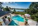Beautiful backyard pool with spa and view of the water at 118 Harbor View Ln, Belleair Bluffs, FL 33770