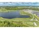 Community overview featuring golf course and lake at 12115 Amica Loop, Venice, FL 34293