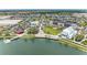 Aerial view of vibrant town center with shops and lake at 12115 Amica Loop, Venice, FL 34293