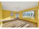 Bright living room with tiled floors and large window at 14017 Miramar Ave, Madeira Beach, FL 33708