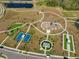 Aerial view of the community park featuring tennis courts, playground and multiple outdoor recreational spaces at 14825 Paddock Pond Ave, Lithia, FL 33547