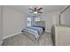 Cozy bedroom with a comfortable bed and plenty of natural light at 14825 Paddock Pond Ave, Lithia, FL 33547