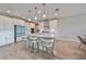 Island kitchen with white cabinets, quartz countertops and a breakfast bar at 14825 Paddock Pond Ave, Lithia, FL 33547