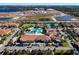 Community clubhouse with pools and tennis at 16847 Whisper Elm St, Wimauma, FL 33598