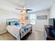 Spacious bedroom with ceiling fan and a comfy bed at 16847 Whisper Elm St, Wimauma, FL 33598